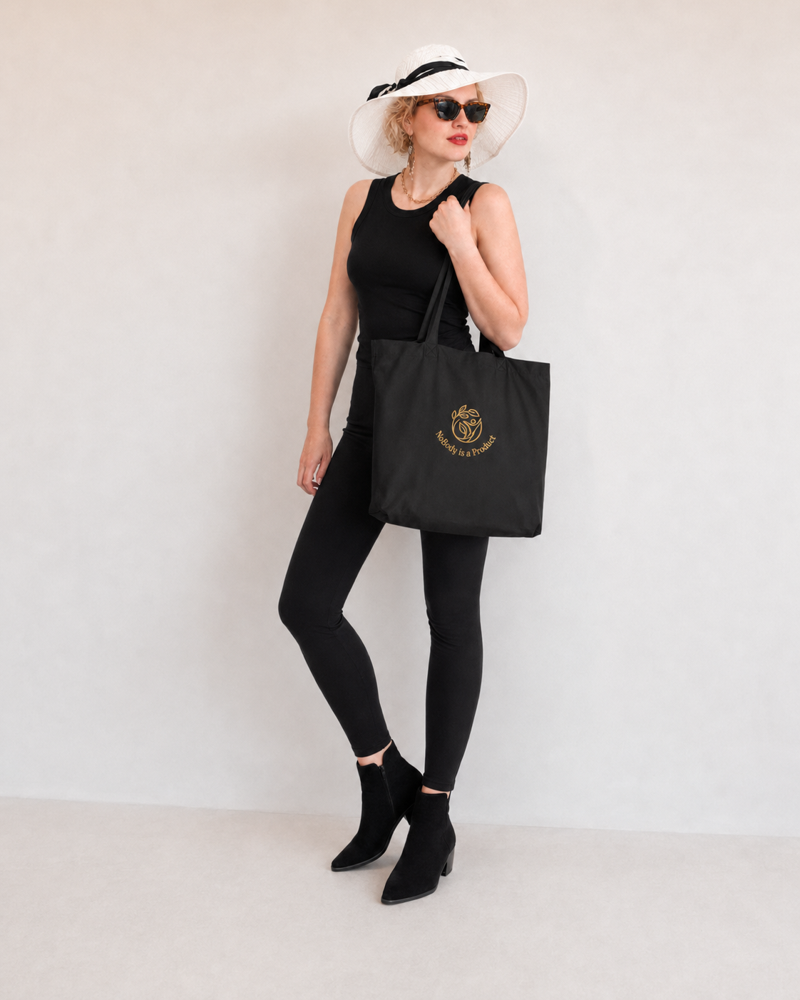 "NoBody is a Product Eco" Organic cotton Tote Bag (Embroidered gold logo)